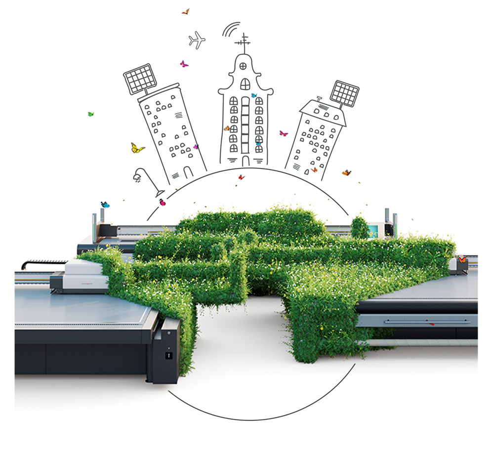 Tres maquinas de impresión digital en gran formato cubiertas parcialmente por vegetación.